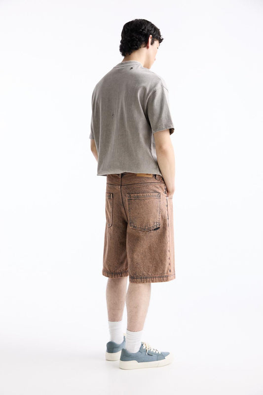 Baggy denim Bermuda shorts with a washed finish